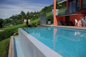 Piscine à débordement (c) Architonic Piscine à débordement (c) Architonic